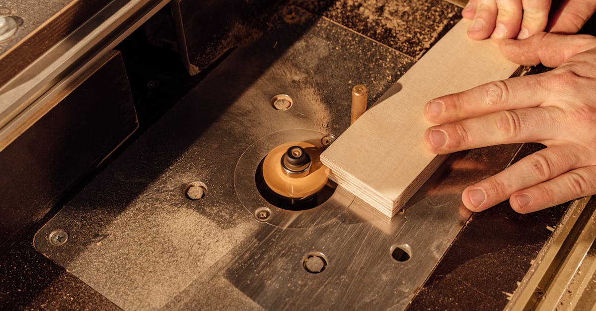 Detailed shot of hands operating industrial woodworking equipment